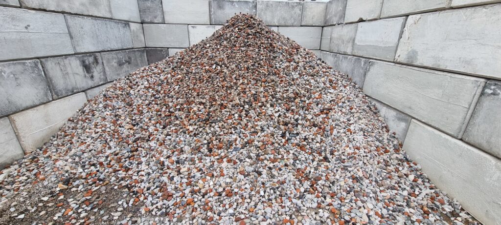 Stored gravel, used for pipe bedding